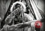 Image of Native American Indian Assinniboine Chief Rides Black Horse Fort Browning Montana USA, 1930, second 8 stock footage video 65675025306