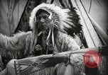 Image of Native American Indian Assinniboine Chief Rides Black Horse Fort Browning Montana USA, 1930, second 11 stock footage video 65675025306