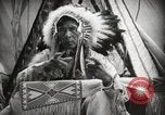 Image of Native American Indian Assinniboine Chief Rides Black Horse Fort Browning Montana USA, 1930, second 14 stock footage video 65675025306