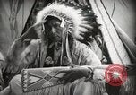 Image of Native American Indian Assinniboine Chief Rides Black Horse Fort Browning Montana USA, 1930, second 15 stock footage video 65675025306