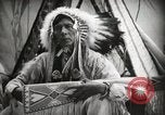 Image of Native American Indian Assinniboine Chief Rides Black Horse Fort Browning Montana USA, 1930, second 16 stock footage video 65675025306