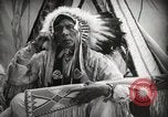 Image of Native American Indian Assinniboine Chief Rides Black Horse Fort Browning Montana USA, 1930, second 17 stock footage video 65675025306