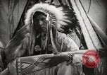 Image of Native American Indian Assinniboine Chief Rides Black Horse Fort Browning Montana USA, 1930, second 18 stock footage video 65675025306