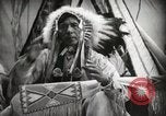 Image of Native American Indian Assinniboine Chief Rides Black Horse Fort Browning Montana USA, 1930, second 19 stock footage video 65675025306