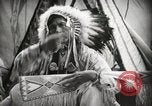 Image of Native American Indian Assinniboine Chief Rides Black Horse Fort Browning Montana USA, 1930, second 21 stock footage video 65675025306