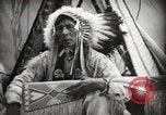 Image of Native American Indian Assinniboine Chief Rides Black Horse Fort Browning Montana USA, 1930, second 22 stock footage video 65675025306