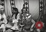 Image of Native American Indian Tribal Council members tell jokes Fort Browning Montana USA, 1930, second 17 stock footage video 65675025317