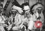 Image of Native American Indian Tribal Council members tell jokes Fort Browning Montana USA, 1930, second 28 stock footage video 65675025317