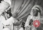 Image of Native American Indian Tribal Council members tell jokes Fort Browning Montana USA, 1930, second 55 stock footage video 65675025317