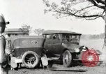 Standbild Ford Pkw und Lkw steckt in Schlamm United States USA, 1920, aus Sekunde 15 historischem Filmmaterial Videoclip 65675025336