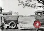 Standbild Ford Pkw und Lkw steckt in Schlamm United States USA, 1920, aus Sekunde 17 historischem Filmmaterial Videoclip 65675025336