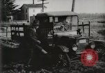 Standbild Ford Pkw und Lkw steckt in Schlamm United States USA, 1920, aus Sekunde 38 historischem Filmmaterial Videoclip 65675025336