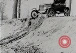 Image of Ford Model T car driving in arduous conditions United States USA, 1922, second 14 stock footage video 65675025340