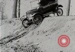 Image of Ford Model T car driving in arduous conditions United States USA, 1922, second 15 stock footage video 65675025340
