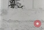 Image of Ford Model T car driving in arduous conditions United States USA, 1922, second 18 stock footage video 65675025340