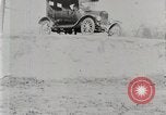 Image of Ford Model T car driving in arduous conditions United States USA, 1922, second 19 stock footage video 65675025340