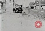 Image of Ford Model T car driving in arduous conditions United States USA, 1922, second 29 stock footage video 65675025340