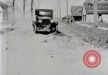 Image of Ford Model T car driving in arduous conditions United States USA, 1922, second 30 stock footage video 65675025340