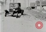 Image of Ford Model T car driving in arduous conditions United States USA, 1922, second 32 stock footage video 65675025340