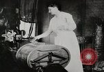 Standbild motorisierte Waschmaschine Staubsauger und Spinning Wheel United States USA, 1920, aus Sekunde 10 historischem Filmmaterial Videoclip 65675025347
