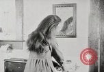 Standbild motorisierte Waschmaschine Staubsauger und Spinning Wheel United States USA, 1920, aus Sekunde 44 historischem Filmmaterial Videoclip 65675025347