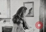 Standbild motorisierte Waschmaschine Staubsauger und Spinning Wheel United States USA, 1920, aus Sekunde 45 historischem Filmmaterial Videoclip 65675025347