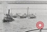 Image of New York Harbor and Brooklyn Bridge seen from steamship New York City USA, 1917, second 19 stock footage video 65675025400