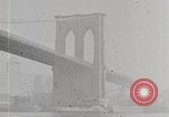 Image of New York Harbor and Brooklyn Bridge seen from steamship New York City USA, 1917, second 23 stock footage video 65675025400
