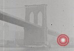 Image of New York Harbor and Brooklyn Bridge seen from steamship New York City USA, 1917, second 24 stock footage video 65675025400