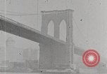 Image of New York Harbor and Brooklyn Bridge seen from steamship New York City USA, 1917, second 26 stock footage video 65675025400