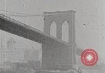 Image of New York Harbor and Brooklyn Bridge seen from steamship New York City USA, 1917, second 27 stock footage video 65675025400
