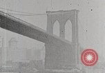 Image of New York Harbor and Brooklyn Bridge seen from steamship New York City USA, 1917, second 28 stock footage video 65675025400