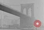Image of New York Harbor and Brooklyn Bridge seen from steamship New York City USA, 1917, second 29 stock footage video 65675025400