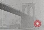 Image of New York Harbor and Brooklyn Bridge seen from steamship New York City USA, 1917, second 30 stock footage video 65675025400