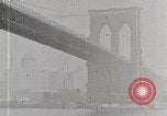 Image of New York Harbor and Brooklyn Bridge seen from steamship New York City USA, 1917, second 31 stock footage video 65675025400