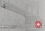 Image of New York Harbor and Brooklyn Bridge seen from steamship New York City USA, 1917, second 32 stock footage video 65675025400