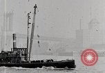 Image of New York Harbor and Brooklyn Bridge seen from steamship New York City USA, 1917, second 34 stock footage video 65675025400