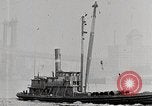 Image of New York Harbor and Brooklyn Bridge seen from steamship New York City USA, 1917, second 36 stock footage video 65675025400