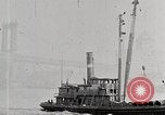 Image of New York Harbor and Brooklyn Bridge seen from steamship New York City USA, 1917, second 37 stock footage video 65675025400