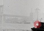 Image of New York Harbor and Brooklyn Bridge seen from steamship New York City USA, 1917, second 40 stock footage video 65675025400