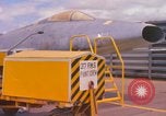 Image of Airman paints F100D plane Phu Cat Vietnam, 1968, second 4 stock footage video 65675025448
