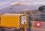 Image of Airman paints F100D plane Phu Cat Vietnam, 1968, second 5 stock footage video 65675025448