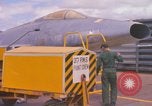 Image of Airman paints F100D plane Phu Cat Vietnam, 1968, second 7 stock footage video 65675025448