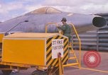Image of Airman paints F100D plane Phu Cat Vietnam, 1968, second 9 stock footage video 65675025448