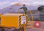 Image of Airman paints F100D plane Phu Cat Vietnam, 1968, second 10 stock footage video 65675025448