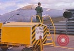 Image of Airman paints F100D plane Phu Cat Vietnam, 1968, second 11 stock footage video 65675025448