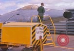 Image of Airman paints F100D plane Phu Cat Vietnam, 1968, second 12 stock footage video 65675025448