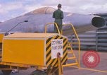 Image of Airman paints F100D plane Phu Cat Vietnam, 1968, second 13 stock footage video 65675025448