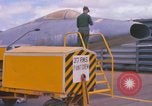 Image of Airman paints F100D plane Phu Cat Vietnam, 1968, second 18 stock footage video 65675025448