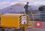 Image of Airman paints F100D plane Phu Cat Vietnam, 1968, second 19 stock footage video 65675025448